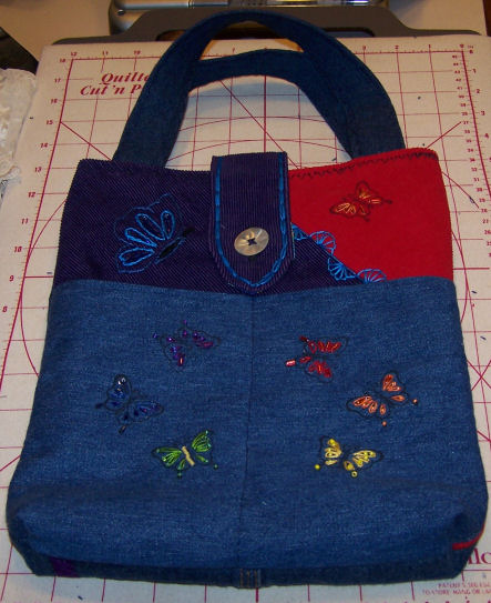 denim bag, machine and hand embroidered butterflies.