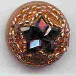 beaded Vegetable Ivory button with faceted garnet star