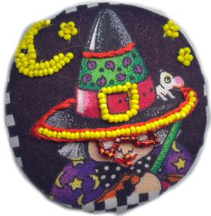  Mary Englebreit witch embellished with beads and floss
