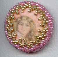  printed silk button with decorative beaded border in pink and gold 